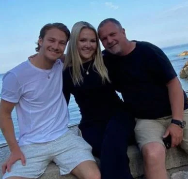Dennis Hauger with his sister and father