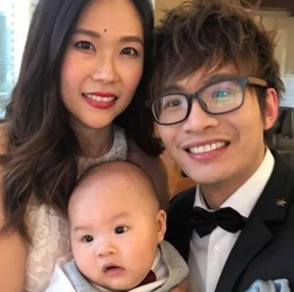 Vinh Quang Giang with his wife and child