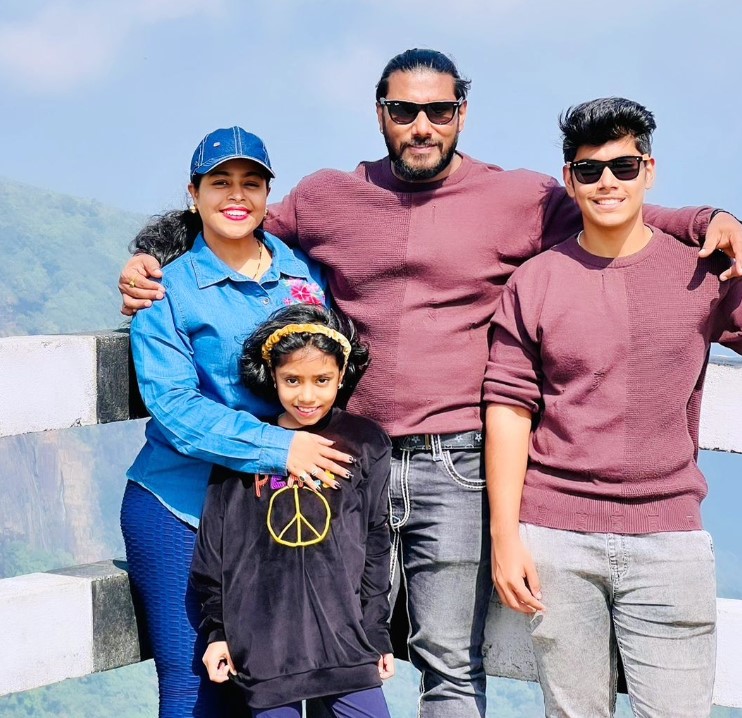 Snehal Sangram Chougule with her husband Sangram Chougule and kids