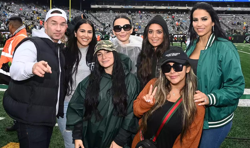 The Jersey Shore cast poses with Sanaa Saleh at the Jets game at MetLife Stadium