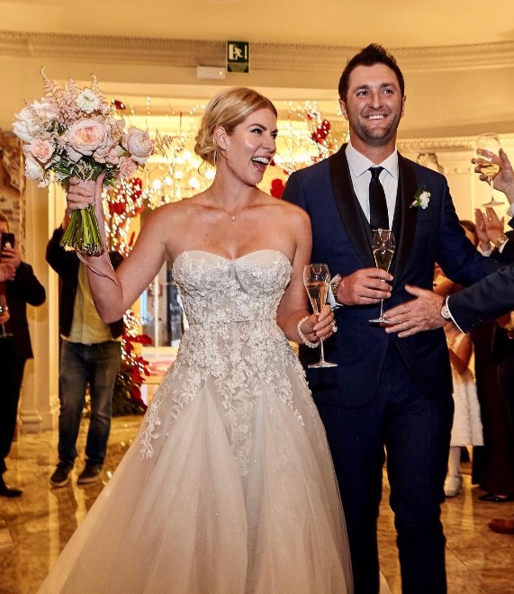 Kelley Cahill and her husband Jon Rahm's wedding image