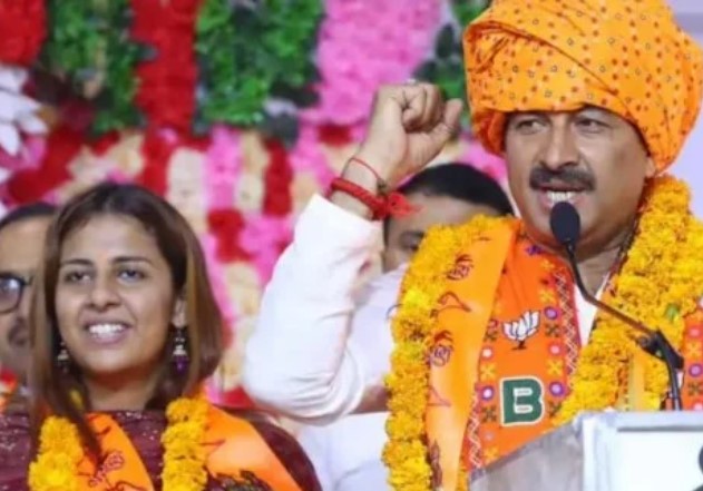 Rhiti Tiwari with her father after joining the BJP in New Delhi
