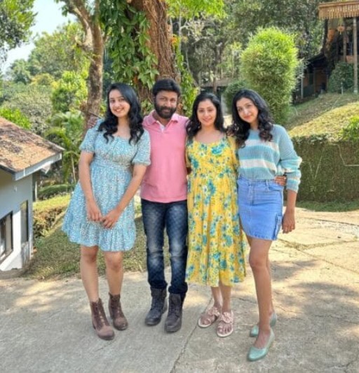 Yuvanraj Nethrun with his wife and daughters
