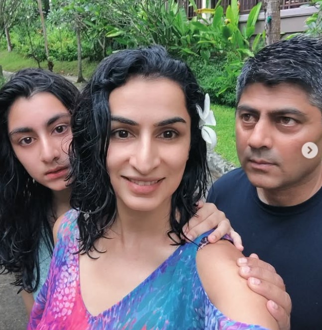 Aditi Arora Sawant with her husband and daughter