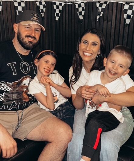 Mary Ours with her husband and kids