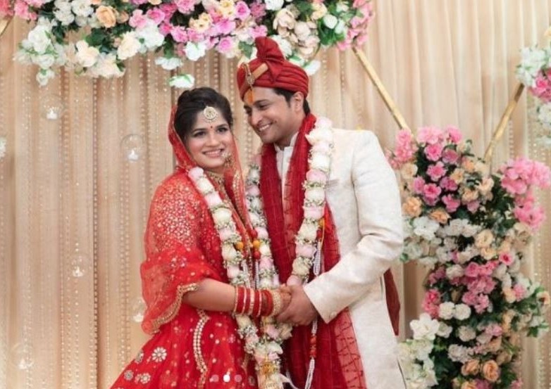 Mahima Mishra and her husband's wedding image