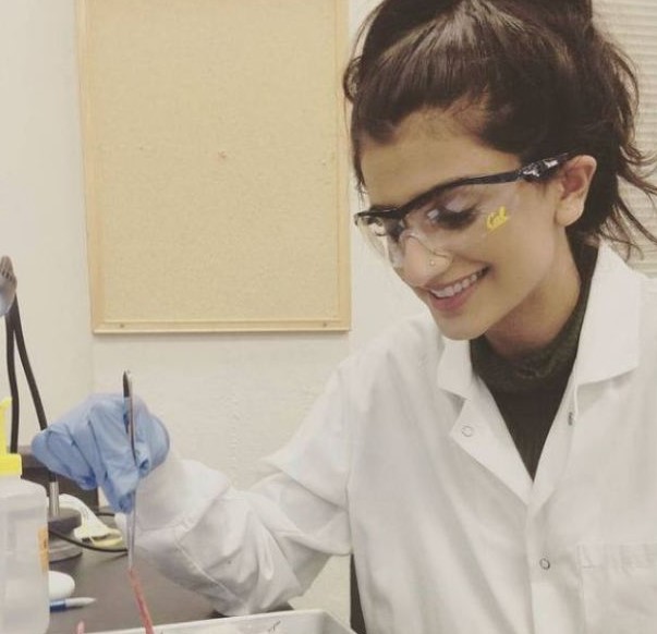 Puneet Kaur performing a biology experiment