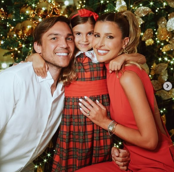 Dandynha Barbosa with her husband and daughter