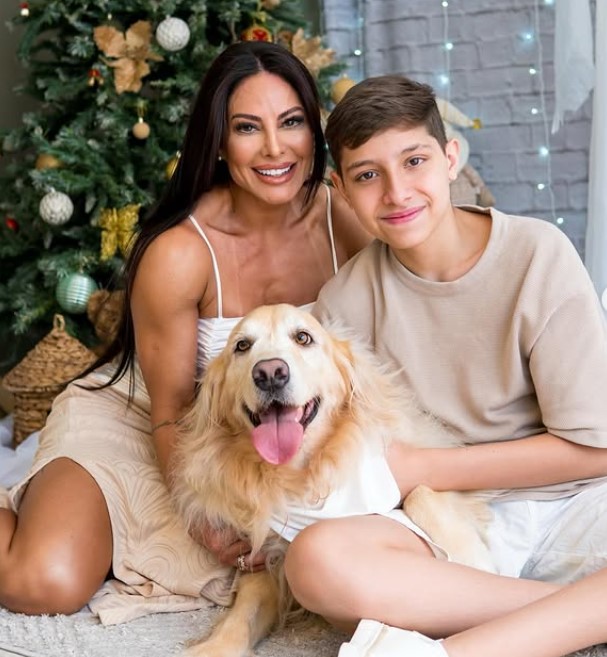 Vivi Sanches with her son and dog
