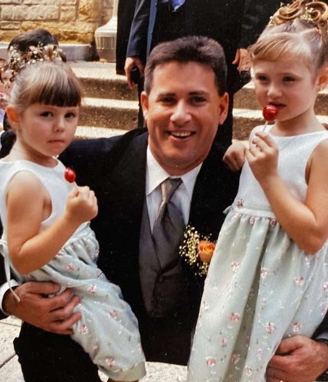 Kim Lloyd's childhood image with her dad and sister
