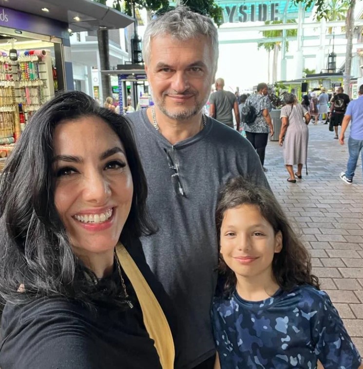 Pamela Cortes with her husband and child