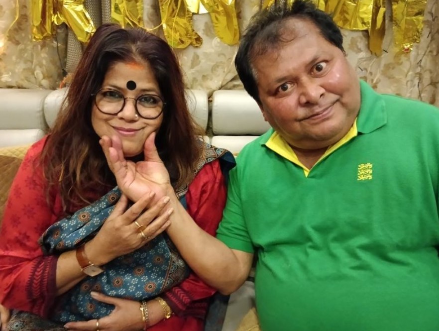 Kharaj Mukherjee with his wife